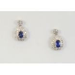 A PAIR OF SAPPHIRE AND DIAMOND DROP EARRINGS each earring set with an oval-shaped sapphire within