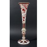 BOHEMIAN GLASS VASE, white cut through to ruby, with painted and gilt floral decoration, height