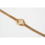 A LADY'S 9CT. GOLD WRISTWATCH BY GARRARD the signed circular dial with dagger numerals and one