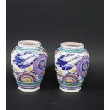 PAIR OF POOLE POTTERY VASES shape number 442 and painted with Birds and stylised flowers and foliage