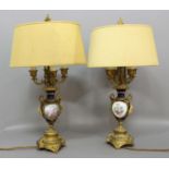 PAIR OF FRENCH ORMOLU AND PORCELAIN LAMPS, 19th century, the Sevres style bodies with painted,