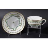 BRISTOL TEACUP AND SAUCER, circa 1760, painted with floral swags in shades of green with gilt