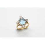 AN AQUAMARINE AND DIAMOND RING the oval-shaped aquamarine is set with four circular-cut diamonds