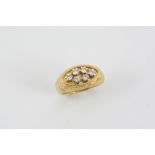 A DIAMOND AND GOLD RING BY GERALD BENNEY the 18ct. gold mount with engraved swirl decoration and set