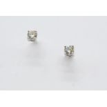 A PAIR OF DIAMOND STUD EARRINGS each set with a brilliant-cut diamond weighing approximately 0.33