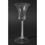 GEORGIAN WINE GLASS, the bell shaped bowl above a single series air twist stem with two spiral