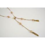A 9CT. GOLD SAUTOIR NECKLACE formed alternately with rope and solid gold bar links, mounted with