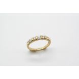 A DIAMOND HALF HOOP RING mounted alternately with a circular-cut diamond and pairs of baguette-cut