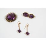 AN AMETHYST, PEARL AND GOLD BROOCH the oval-shaped amethyst is set within a gold border mounted with