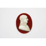 A WHITE GLASS PORTRAIT RELIEF MEDALLION depicting the head and shoulders of Napoleon Bonaparte