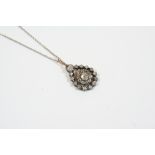 A VICTORIAN DIAMOND CLUSTER PENDANT the central flowerhead diamond cluster is suspended with a