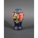 MOORCROFT MINIATURE VASE - POMEGRANATE a miniature vase painted in the Pomegranate design on a