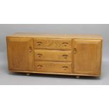 ERCOL SIDEBOARD a large light elm sideboard with 3 central drawers (one with cutlery compartment),