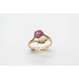 AN OPAL AND PINK SAPPHIRE TWO STONE RING the oval-shaped pink sapphire is set with an oval solid