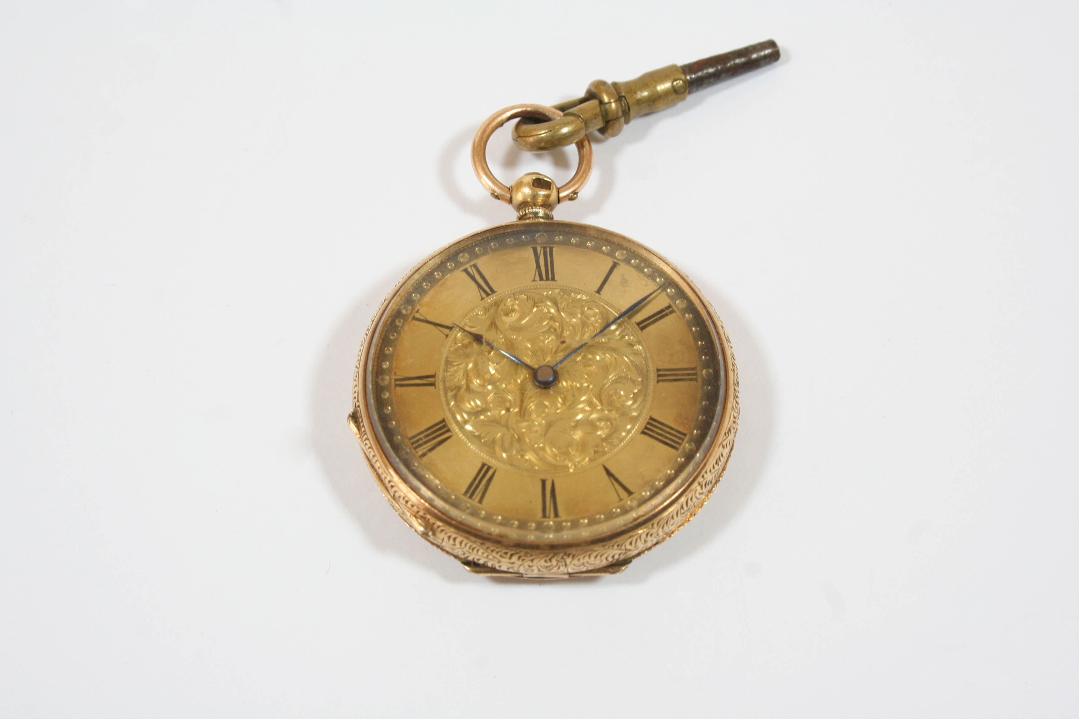 AN 18CT. GOLD OPEN FACED POCKET WATCH the gold foliate dial with Roman numerals, with foliate