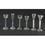 SET OF SIX MINIATURE ENAMEL TWIST WINE GLASSES, in the 18th century style, to include two blue and