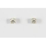 A PAIR OF DIAMOND STUD EARRINGS each set with a brilliant-cut diamond weighing approximately 0.30