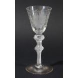 GEORGIAN WINE GLASS, the rounded funnel bowl with engraved vine leaves and polished grapes on a