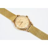 A GENTLEMAN'S GOLD WRISTWATCH BY GARRARD the signed circular dial with Arabic numerals and