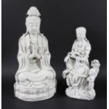 CHINESE BLANC DE CHINE FIGURE OF GUANYIN, seated with hands together, on a moulded base, impressed