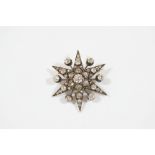 A VICTORIAN DIAMOND STARBURST BROOCH set overall with graduated old brilliant-cut diamonds, in