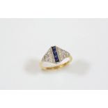 A SAPPHIRE AND DIAMOND RING mounted with four calibre-cut sapphires, with circular-cut diamonds