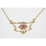 AN EARLY 20TH CENTURY TOURMALINE AND SEED PEARL NECKLACE the openwork foliate scrolling design is