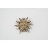 A VICTORIAN DIAMOND STAR BROOCH PENDANT set overall with graduated old brilliant-cut diamonds in