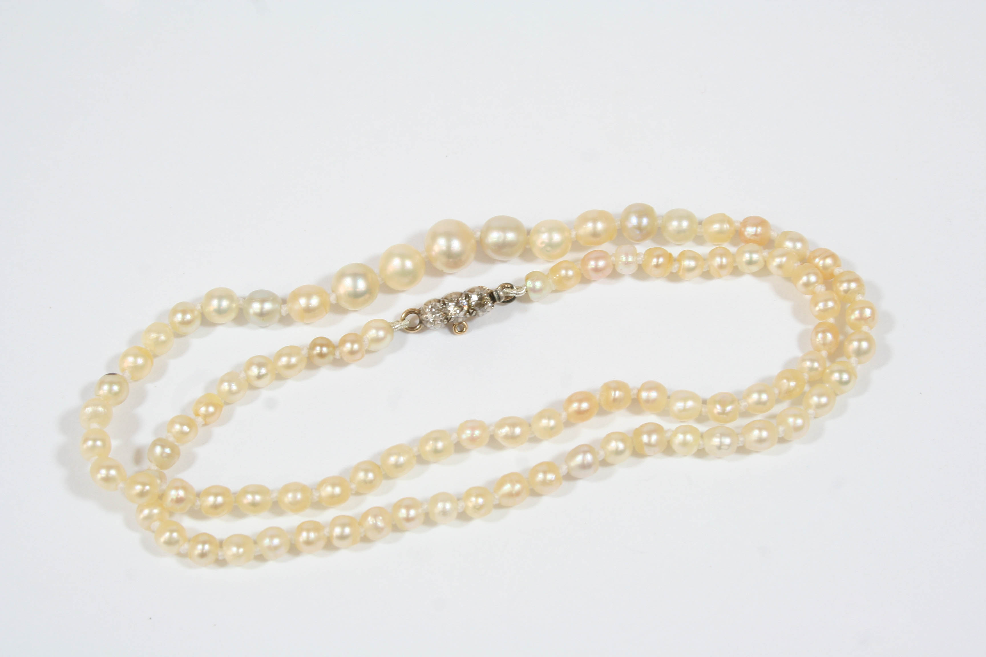 A SINGLE ROW GRADUATED NATURAL PEARL NECKLACE the eighty nine pearls graduate from 3.1 to 5.7mm.