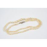 A SINGLE ROW GRADUATED NATURAL PEARL NECKLACE the eighty nine pearls graduate from 3.1 to 5.7mm.