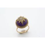 AN AMETHYST AND PEARL SET RING the circular cabochon amethyst is mounted with a half pearl set