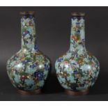 PAIR OF CHINESE CLOISONNE VASES, 19th century, of bottle form, with prunus and other flowers on a