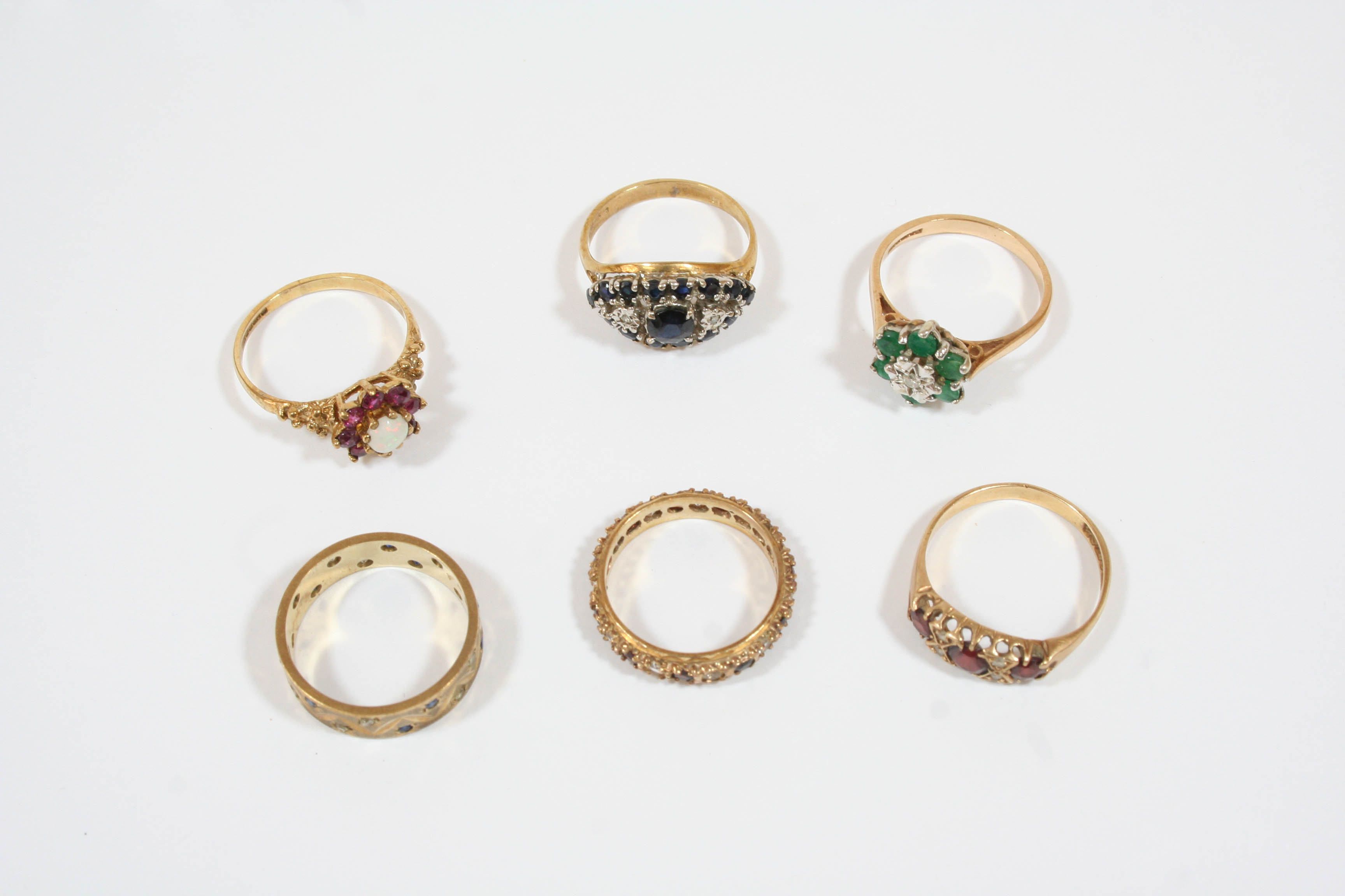 SIX ASSORTED 9CT. GOLD AND GEM SET RINGS total weight 17.4 grams.