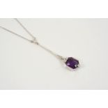 AN ART DECO AMETHYST AND DIAMOND NECKLACE the cut cornered rectangular-shaped amethyst is set with