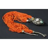 TIBETAN CORAL NECKLACE, the multiple strands of fine beads on a white metal snuff bottle mounted