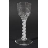 WINE GLASS, the ogee bowl with moulded base on a double series opaque twist stem of four spiral