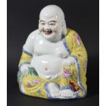 CHINESE BUDDHA. 20th century, seated wearing a yellow enamelled robe with pink and blue flowers,