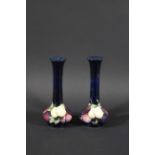 PAIR OF MOORCROFT VASES - WISTERIA a pair of slender Moorcroft vases, painted in the Wisteria design