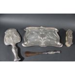 ART NOUVEAU SILVER DRESSING TABLE SET comprising a tray, mirror, brush and shoe horn, each piece