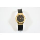 AN 18CT. GOLD WRISTWATCH BY HUBLOT the signed black dial with date aperture, with circular-cut