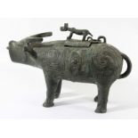 CHINESE BRONZE VESSEL, in the form of an ox or buffalo, with scrolling decoration and a dog handle