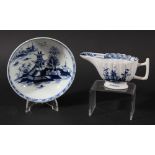 LOWESTOFT BUTTER BOAT, circa 1770, the reeded body blue painted with a chinoiserie pagoda scene,