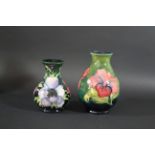 MOORCROFT VASE a circa 1920's/30's vase in the Hibiscus design, the flowers painted on a green