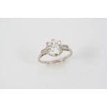 A DIAMOND SOLITAIRE RING the round brilliant-cut diamond weighs 3.05 carats and is set with a