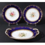 COALPORT DESSERT SERVICE, early 20th century, painted with floral sprays inside a blue and gilt