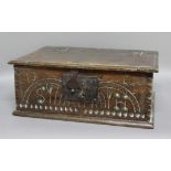 OAK BIBLE BOX, 17th century, with a hinged cover, iron lock and arch carved front, height 19cm,