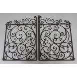 PAIR OF WROUGHT IRON GATES, with scrolling decoration, height 70cm, overall width 100cm