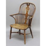 YEW AND ELM WINDSOR CHAIR, earlier 19th century, the arched back above a pierced, vase shaped splat,