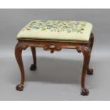 VICTORIAN WALNUT STOOL, the woolwork upholstered, drop in seat above carved aprons and cabriole legs