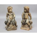 PAIR OF CARVED WOOD FIGURES OF BACCHIC CHERUBS, possibly walnut, both seated on rocks and holding